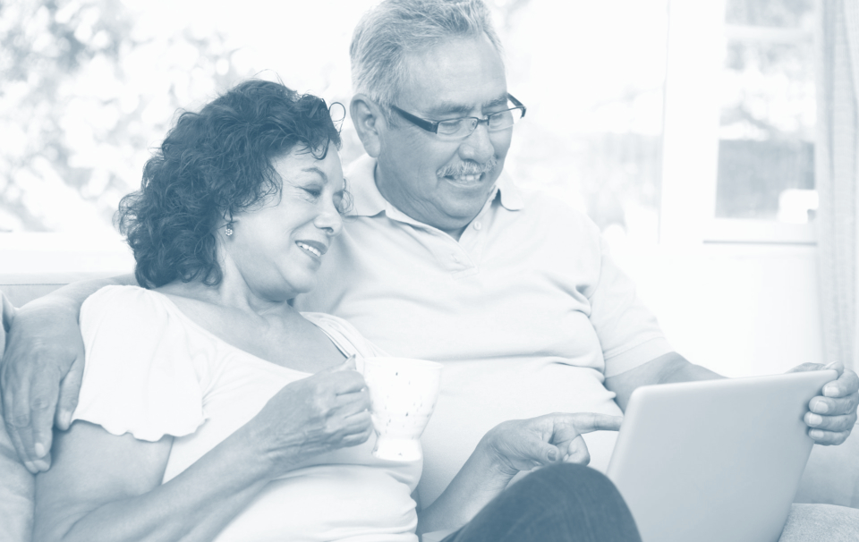 elderly couple using a tablet